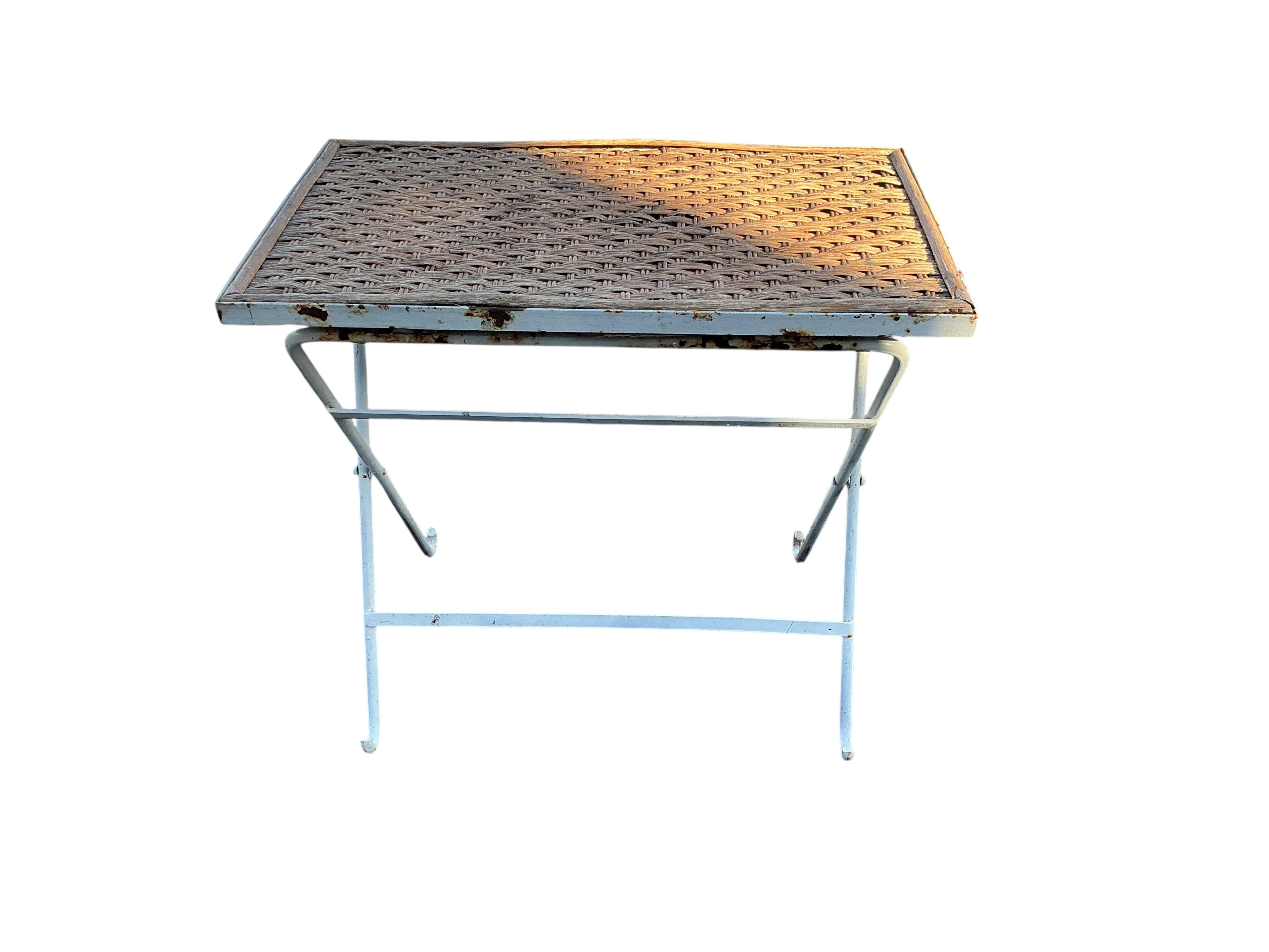 Five galvanised containers, largest width 72cm, a metal anchor and a small rattan top garden table